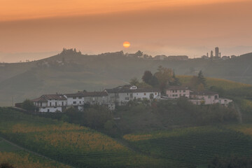 Amazing sunset over the Langhe, famous vineyard UNESCO area of Piedmont, Italy during autumn