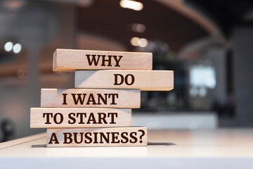 Wooden blocks with words 'Why Do I Want to Start a Business?'.