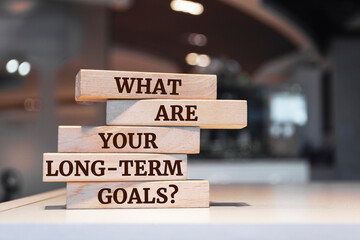 Wooden blocks with words 'What Are Your Long-Term Goals?'.