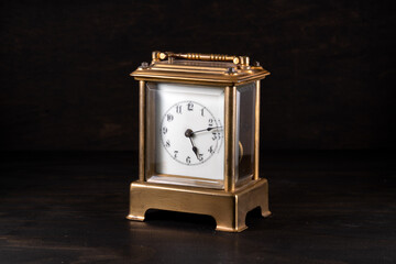 antique brass carriage clock isolated on a black background - Powered by Adobe