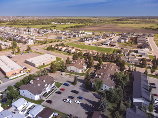 residential area in North America with homes and urban meets rural edge of city of edmonton,...