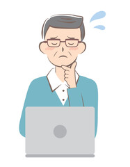 パソコン操作で困っているシニア男性