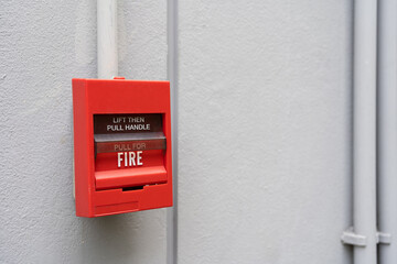 Fire alarm switch on the wall. Fire alarm switch on the factory wall.