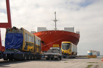articulated tram made in France arrives at Web Dock on huge carrier vessel called Texas