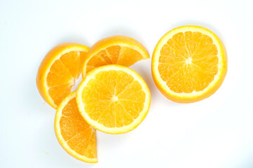 Set with tasty ripe slices of orange on white background