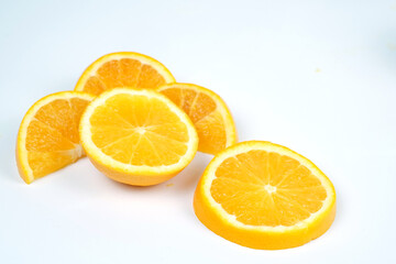 Set with tasty ripe slices of orange on white background