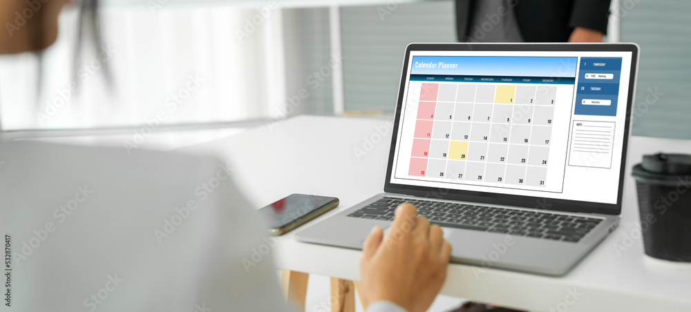Poster calendar on computer software application for modish schedule planning for personal organizer and on
