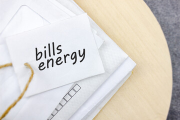 Bills energy. Envelopes, letters with payment of utilities, electricity, heating. Concept of letters with the words BILLS ENERGY.
