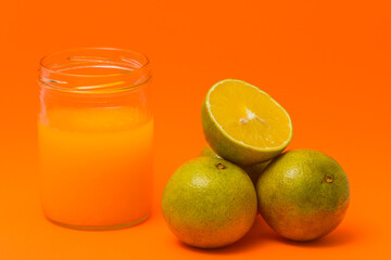 glass of orange juice and orange fruit