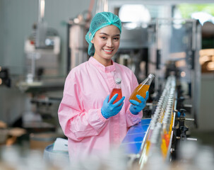 Asian professional food scientist checking and control quality of beverage - 532872036