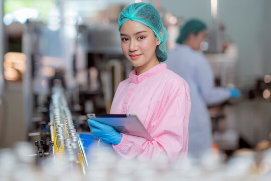 Asian professional food scientist checking and control quality of beverage