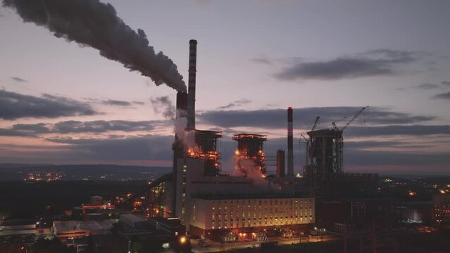 Aerial view of industrial area with chemical plant. Smoking chimney from factory