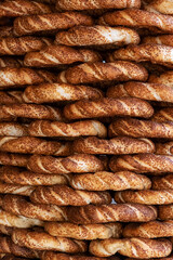 Traditional delicious street food Simit. Background from Turkish sesame bagels