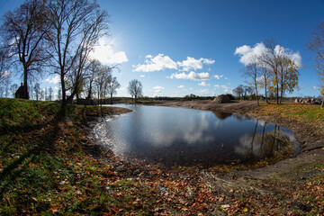 Fototapeta na wymiar Cleaned Park pond in autumn