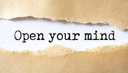 OPEN YOUR MIND written under torn paper.