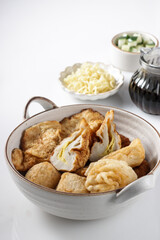 Pempek Palembang is a traditional fish cake from South Sumatera, served with cuko sauce.