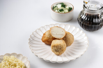 Pempek Adaan or Pempek Bulat is round shape of fish cake from Palembang, served with cuko sauce.