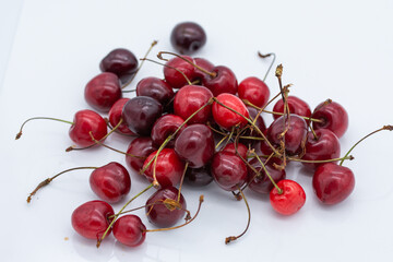 Obraz na płótnie Canvas Cherries on a white background, Cherry Nutrition A Guide to, and Health Benefits