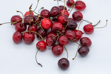 Obraz na płótnie Canvas Cherries on a white background, Cherry Nutrition A Guide to, and Health Benefits