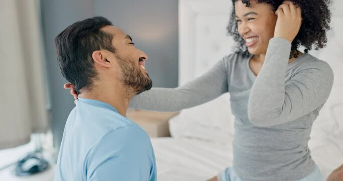 Love, flirting and laughing bedroom couple relaxing at home for romance, bonding and intimate together. Happy, valentines day and smile young people in romantic relationship, honeymoon and happiness