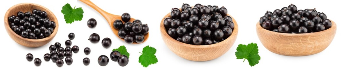 black currant in wooden bowl isolated on white background. macro. clipping path