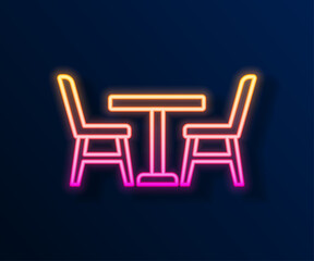 Glowing neon line Wooden table with chair icon isolated on black background. Vector
