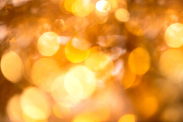 Obraz premium Abstract fective background with shine golden bokeh and sparling particles for wedding, holiday and party time.
