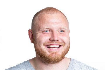 Laughing red-haired man with a beard and beautiful blue eyes. Positivity, optimism and emotions. Isolated on white background. Close-up.