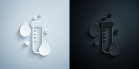 Paper cut Test tube with water drop icon isolated on grey and black background. Paper art style. Vector © Iryna