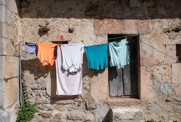 colored clothes hanging on the street