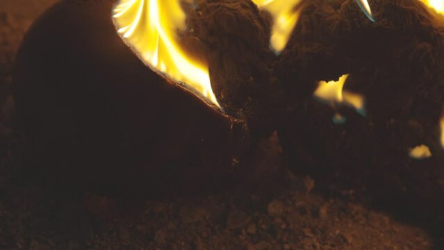 The doll burns with a bright flame. an eerie spectacle of burning