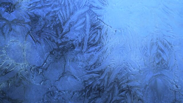 Abstract frosty pattern on glass, background texture on the window