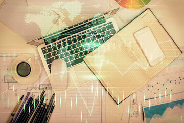 Multi exposure of forex chart drawing over table background with computer. Concept of financial...