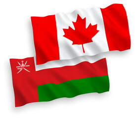 National vector fabric wave flags of Canada and Sultanate of Oman isolated on white background. 1 to 2 proportion.