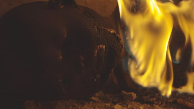 plastic doll on fire. sacrifice for halloween