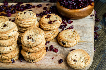 Obraz na płótnie Canvas delicious dried cookies made of high-quality flour with dried red cranberries on the table