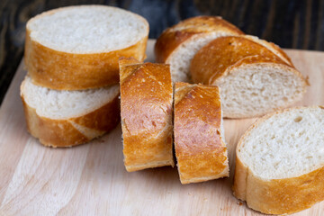 sliced into pieces a long baguette with a crispy crust