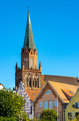 Obraz premium Historic Holy Mary gothic Kosciol Mariacki church in old town quarter of Trzebiatow in Poland