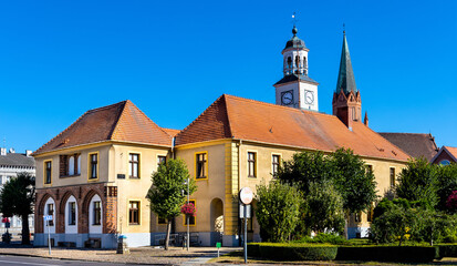 Fototapeta na wymiar Classicist Ratusz town hall palace at Rynek main market square in historic old town quarter of Trzebiatow in Poland