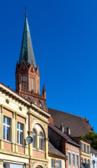 Panorama of Rynek main market square with Holy Mary gothic church in old town quarter of Trzebiatow in Poland