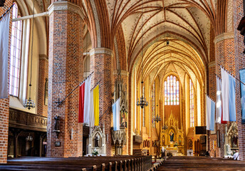 Main nave with altar and presbytery of historic Holy Mary gothic Kosciol Mariacki church in old...