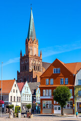 Panorama of Rynek main market square with Holy Mary gothic church in old town quarter of Trzebiatow in Poland