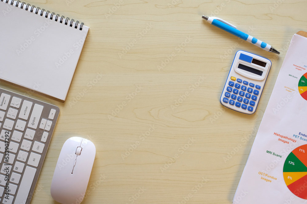 Poster mockup of a workspace desk in a flat lay top view. image of a workspace with a laptop, calculator, k