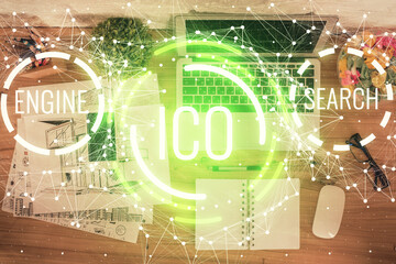 Blockchain theme hologram drawings over computer on the desktop background. Top view. Double...