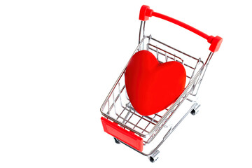 Big red heart in a small shopping cart on white