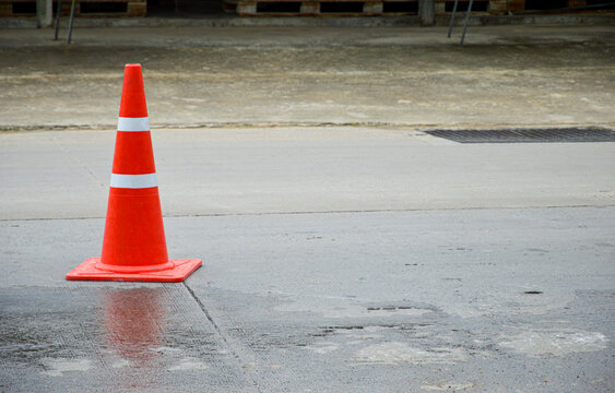 Orange Traffic Cone Set On The Road