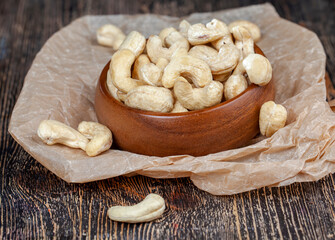 Peeled raw cashew nuts on the table