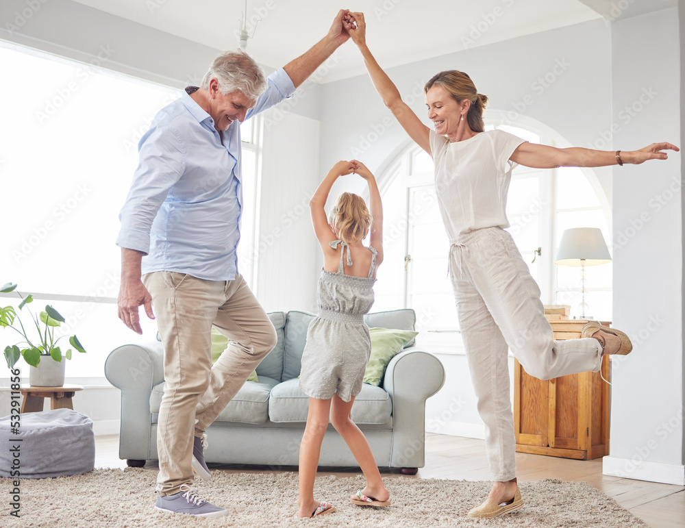 Wall mural Girl dance with grandparents on living room, have fun and happy time in home. Senior man, smile in house with woman and child, dancing and playing together in their lounge at family home