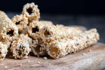 waffle tube with chocolate filling and crushed peanuts