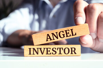 Wooden blocks with words 'Angel Investor'.